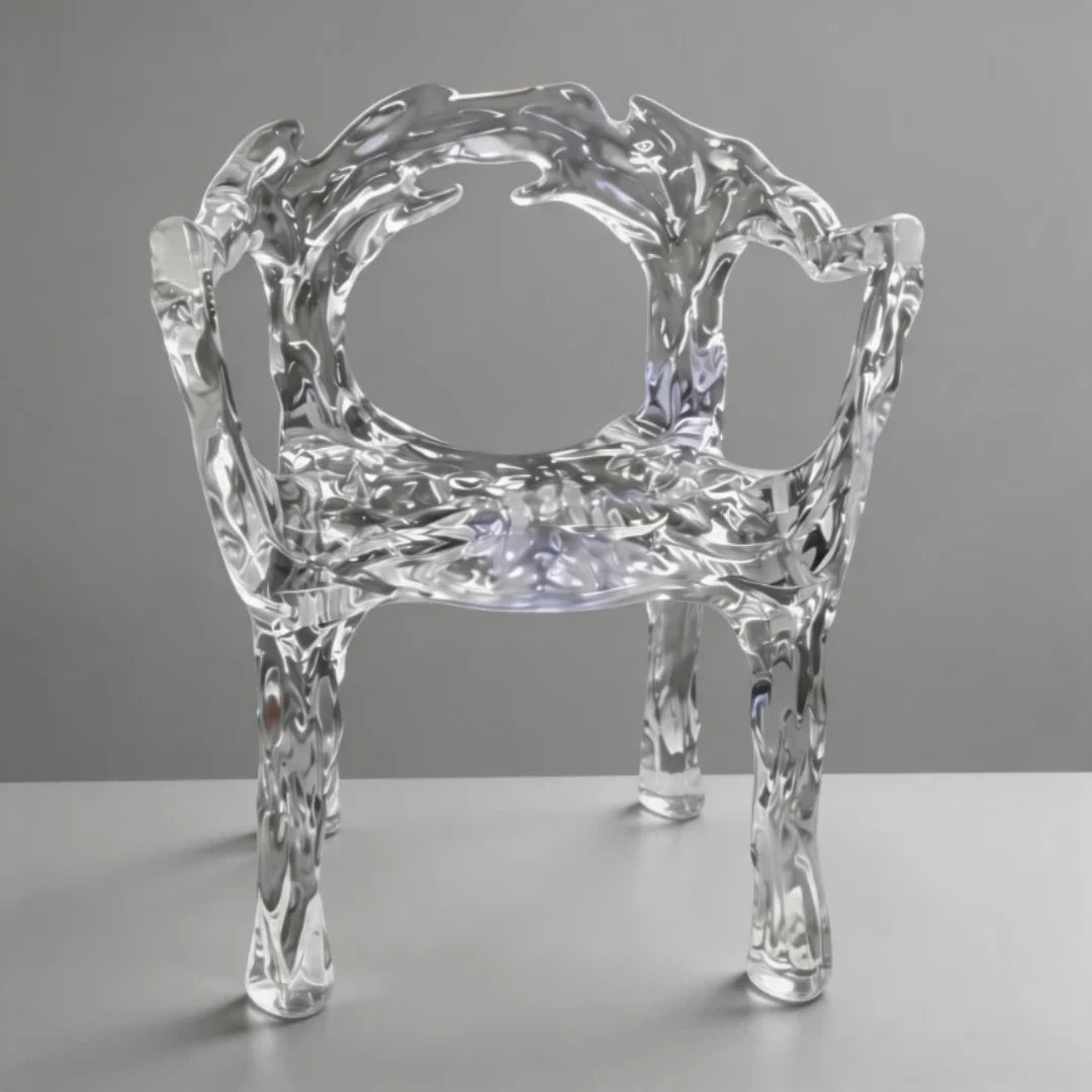 CH02 crystal×clear sculptural resin chair with fluid arms and an open round back