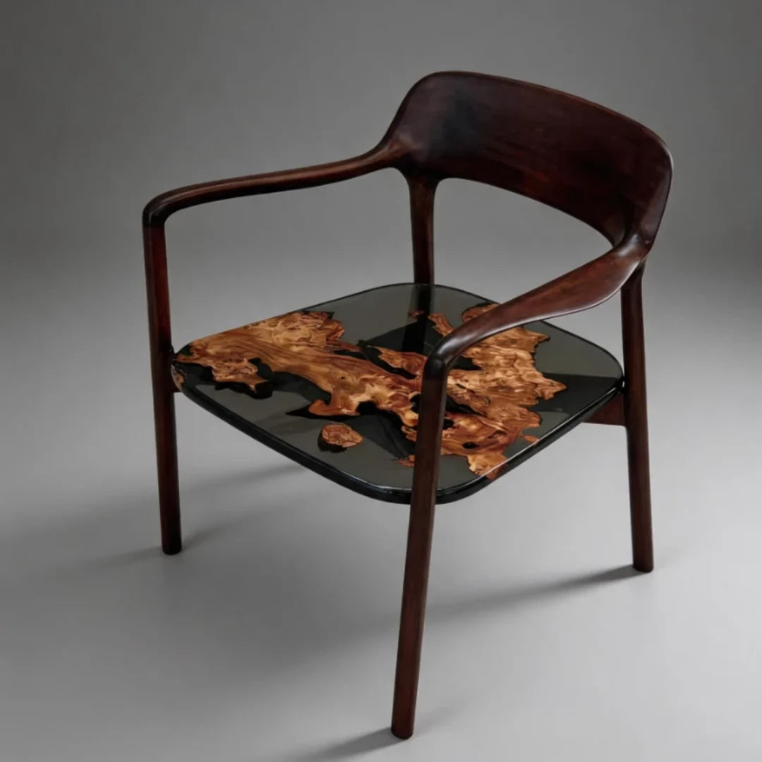 CH11 dark wood armchair with midnight×black epoxy and natural burl islands