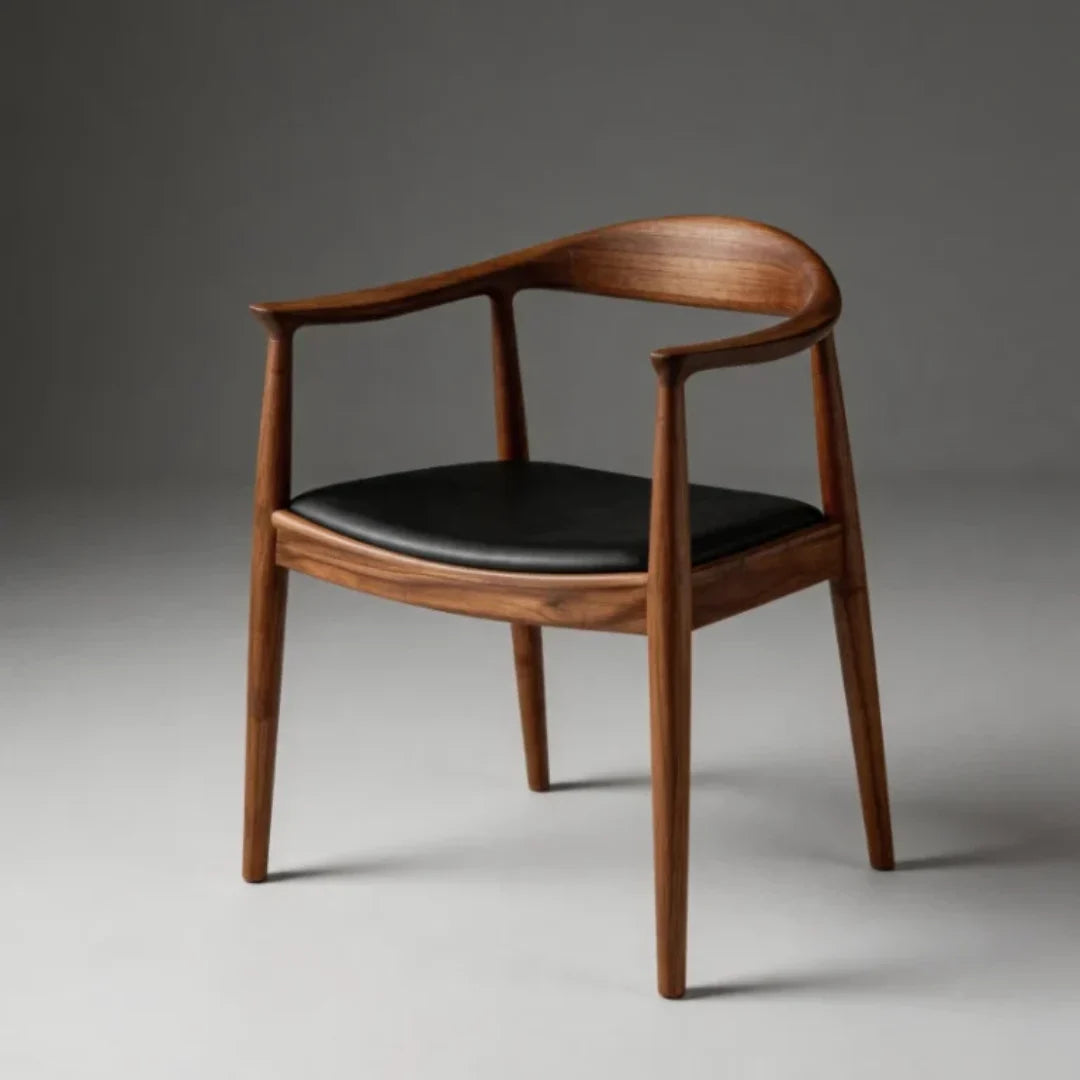 CH12 wood armchair with curved back and smooth black leather cushion