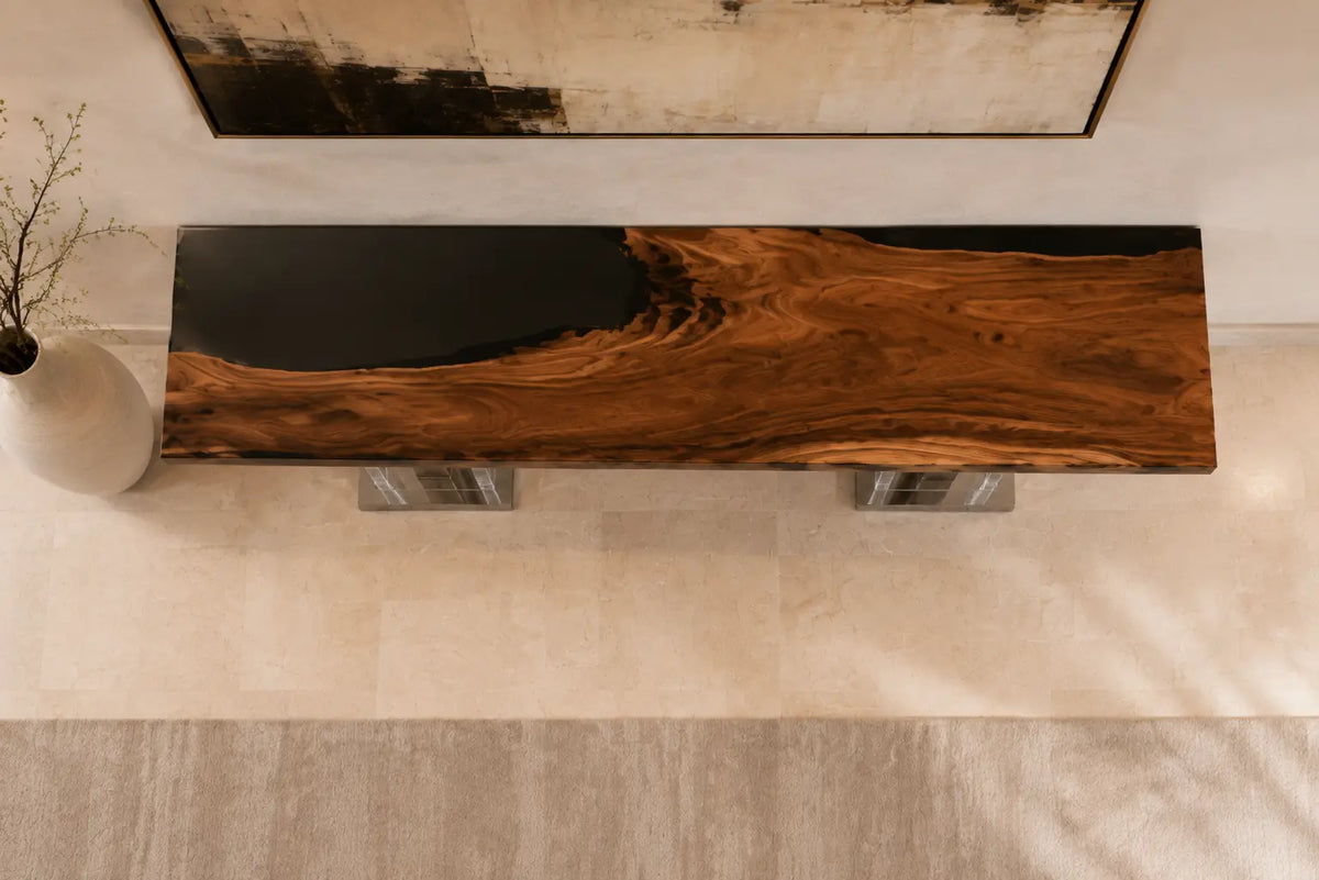 CST02 Noir Axis walnut epoxy console table featuring a broad jet-black resin panel and warm linear grain