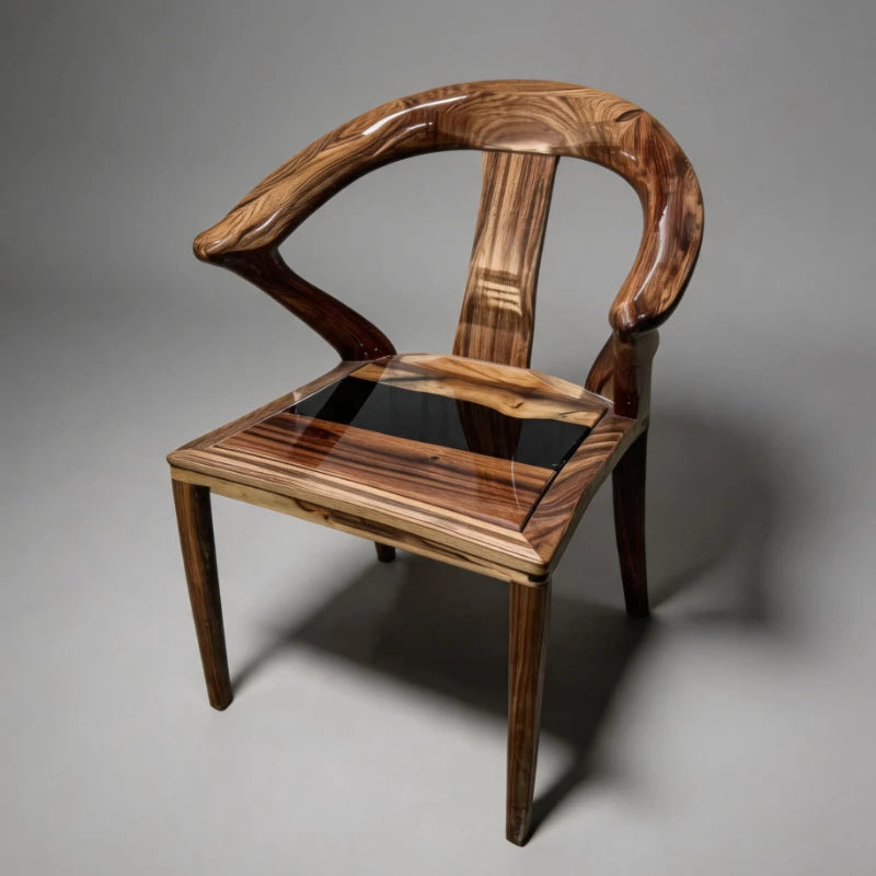CH09 sculpted wood chair with a black resin seat and curved open back